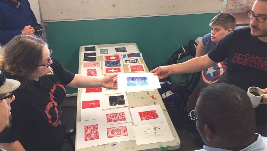 art instructor with students in a print making class in an art studio in Eugene, Oregon